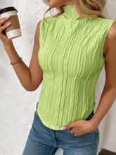 A vibrant lime green texture turtleneck sleeveless top with ribbed texture and high neckline