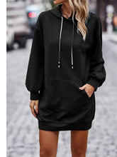 Black textured drawstring tunic hoodie dress with long sleeves and kangaroo pocket