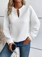 White quilted textured long sleeve notched sweatshirt with v neck and button detail slightly stretchy machine wash care instructions
