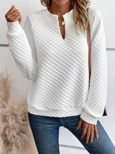 White quilted textured long sleeve notched sweatshirt with half-zip neckline and ribbed cuffs slightly stretchy machine wash