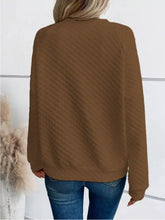 Brown textured notched raglan sleeve knit sweater with relaxed fit and ribbed cuffs machine wash cold safe