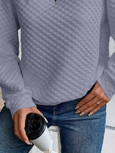 Light gray textured notched raglan sleeve sweatshirt with diamond quilted pattern in slightly stretchy material