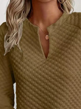 Olive green textured notched raglan sleeve sweatshirt with a subtle diamond pattern and slightly stretchy material