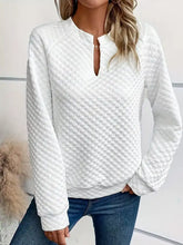 White quilted long-sleeve textured notched raglan sweatshirt with subtle diamond pattern keyhole neckline made of slightly stretchy material