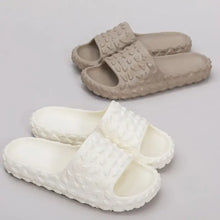 Two pairs of beige and white open toe platform slippers