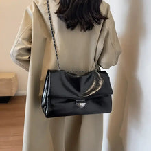 Textured PU leather shoulder bag with silver clasp and chain strap