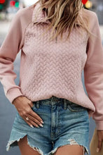 Women’s textured quarter zip long sleeve sweatshirt in light pink with quilted chevron