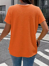 Vibrant orange textured short sleeve blouse with relaxed fit perfect for casual and semi-formal wear