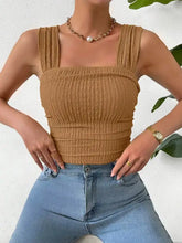 Tan ribbed crop top featuring a textured square neck with wide gathered straps for stylish casual wear