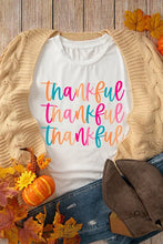 Thankful white t shirt for women in basic style with colorful cursive lettering and beige cardigan
