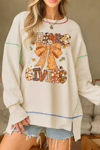 Cream-colored oversized thanksgiving graphic crew neck sweatshirt with patchwork bow and autumn leaf design machine wash cold tumble dry low