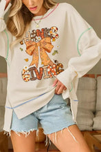 Cream-colored oversized thanksgiving graphic crew neck sweatshirt with large bow and patchwork lettering machine wash cold tumble dry low