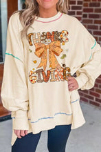 Cream-colored oversized thanksgiving graphic crew neck sweatshirt with large bow and autumn patterned lettering machine wash cold tumble dry low