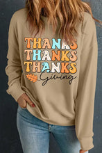 Woman in Thanksgiving round neck dropped shoulder sweatshirt with autumn leaves design