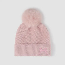 Pink thermal bow knit hat with faux fur pom-pom and embroidered bow