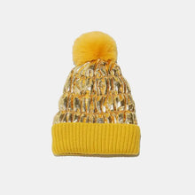 Gold thermal knit hat with yellow brim and fluffy pompom