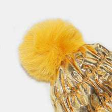 Gold metallic quilted thermal knit hat with yellow faux fur pom-pom
