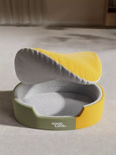 Thickened oval two-tone plush pet nest with yellow gray plush interior