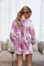 Tie-dye dropped shoulder top in soft pink and white with long sleeves and relaxed fit for comfortable loungewear