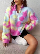 A cozy tie-dye fuzzy quarter zip sweatshirt in pastel pink yellow and blue with slightly stretchy material