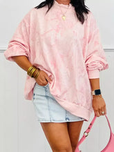 Pink marble-patterned tie-dye oversized mock neck sweatshirt made of slightly stretchy fabric machine wash cold