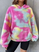 A cozy tie-dye plush fleece hoodie in vibrant pink yellow and light blue hues easy to machine wash cold