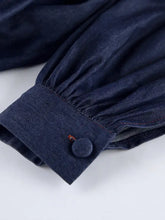 Dark blue denim sleeve with button and red stitching on Tie Front Denim Top