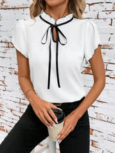 White blouse with tie neck short ribbon tie at neckline and ruffled neck short sleeve design for elegant wear