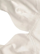 A sleek off-white white satin tie shoulder bra with smooth glossy fabric and precise stitching for elegant wear