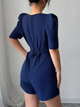 Navy blue tie waist short sleeve romper with puff sleeves