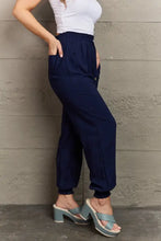 Women’s navy blue tied long joggers with pockets and drawstring