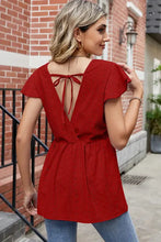 Red eyelet tied ruffled round neck peplum T-shirt with tie-back deep V-neck