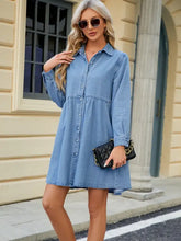 Light blue denim dress with button front tiers and long sleeve denim shirt style for casual wear