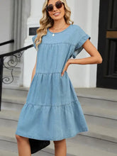 Light blue denim dress with tiered round neck short flutter sleeves and ruffle layers in soft denim fabric