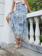 Light blue denim patchwork skirt with tiered ruffle layered sheer fabric and a tied waistband detail