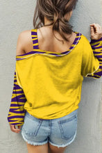 Tiger graphic asymmetrical neck long sleeve yellow top with denim shorts