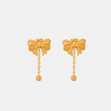 Titanium steel bow earrings with gold bow studs, dangling chains, and spherical drops