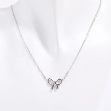 Titanium steel bow pendant necklace with delicate silver chain