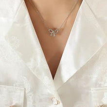 Titanium steel bow pendant necklace with clear gemstones and butterfly ring