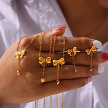 Gold-plated titanium steel bow pendant necklace with heart charms