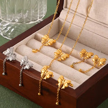 Gold-Plated Titanium Steel Bow Pendant Necklace with Dangling Chains and Beads