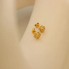 Pair of titanium steel rose stud earrings in gold rose shape