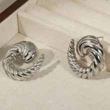Silver-toned titanium steel spiral shape stud earrings with ridged texture