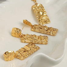 Gold titanium steel textured geometric earrings set with hammered pendant