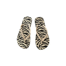 Pair of zebra print toe post flats slippers with beige straps
