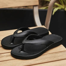 Black toe post flats slippers with textured soles and adjustable straps