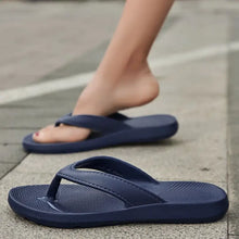 Navy blue toe post flats slippers with textured soles and rubber straps