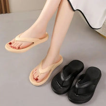Two pairs of toe post flats slippers in beige and black
