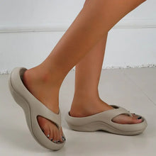 Pair of beige toe post platform slippers with wide strap