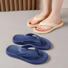 Two pairs of toe post platform slippers in beige and navy blue